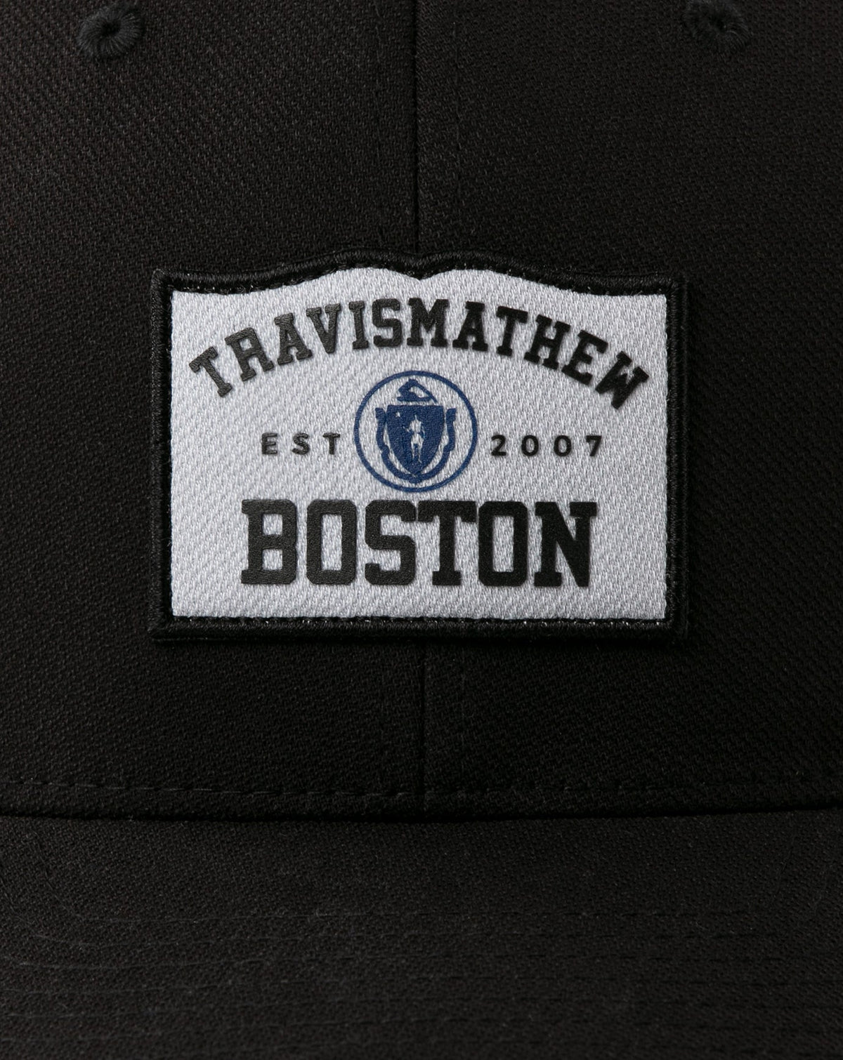 Boylston Fitted Hat Black | Travis Mathew Featured