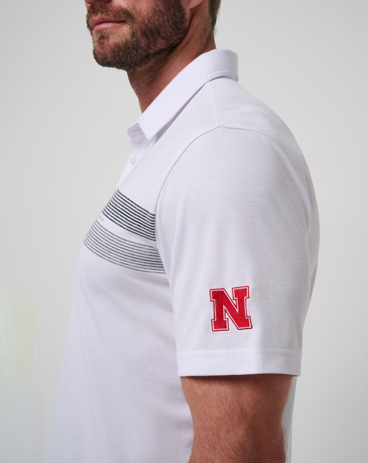 Nebraska Top Recruit Polo White/Black | Travis Mathew Smart Buy