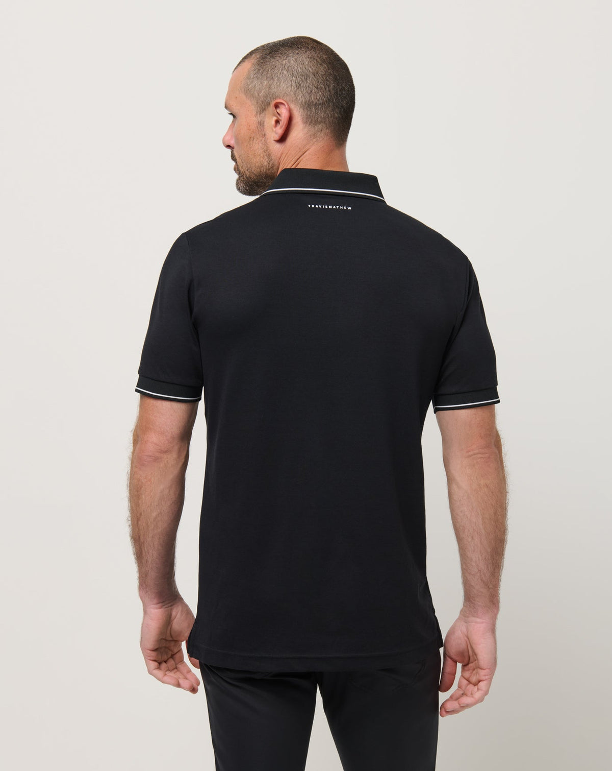 Happier Hour Polo Black | Travis Mathew Smart Buy