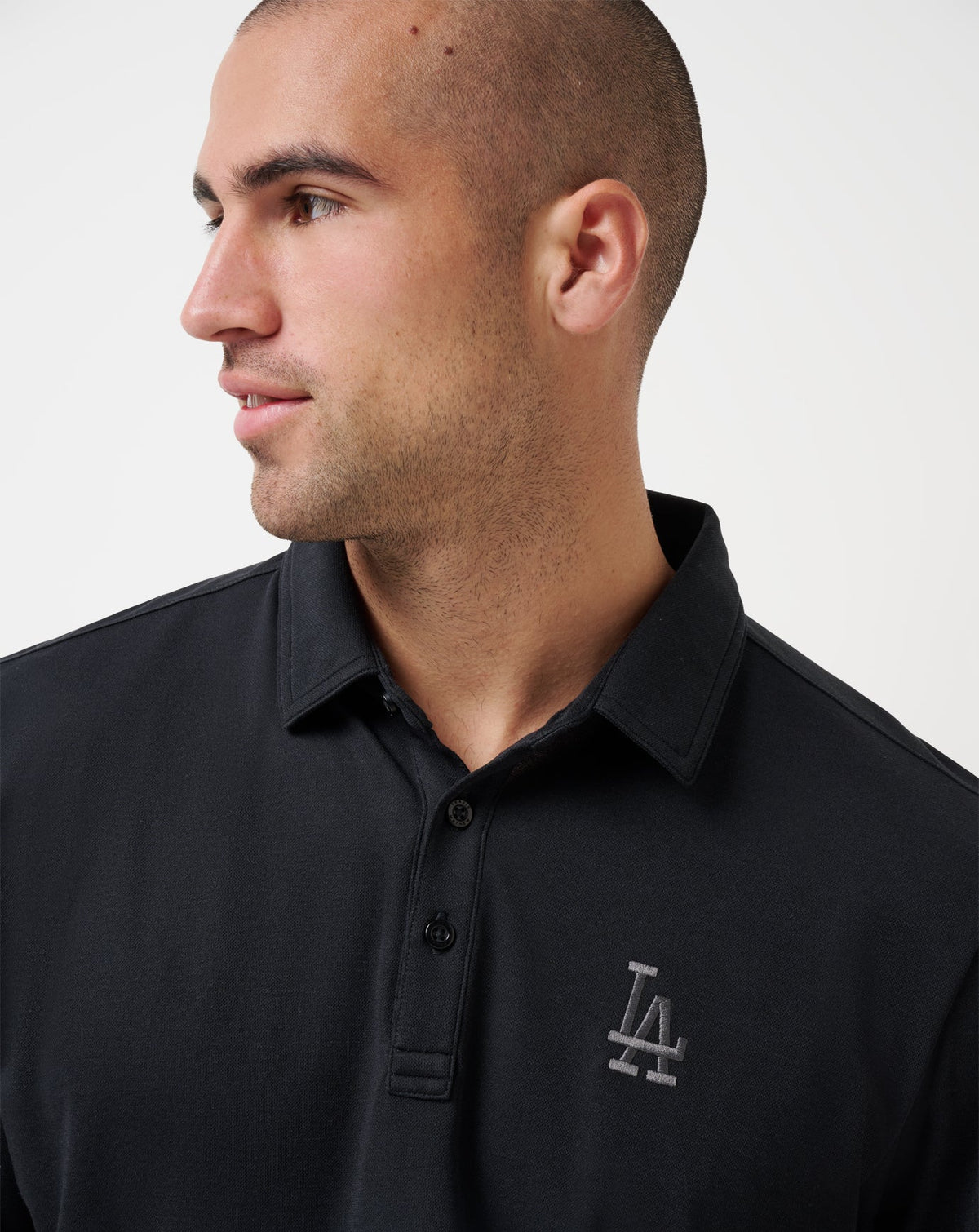 Los Angeles Dodgers Playoff Pitch Polo Black | Travis Mathew Everyday