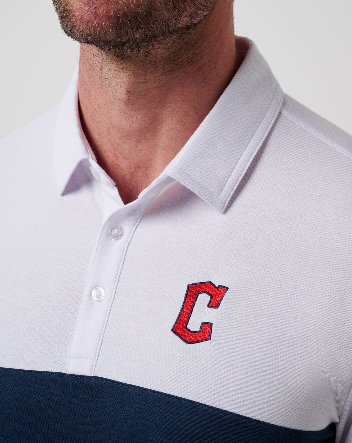 Cleveland Guardians Home Run Leader Polo White/Navy | Travis Mathew Premium