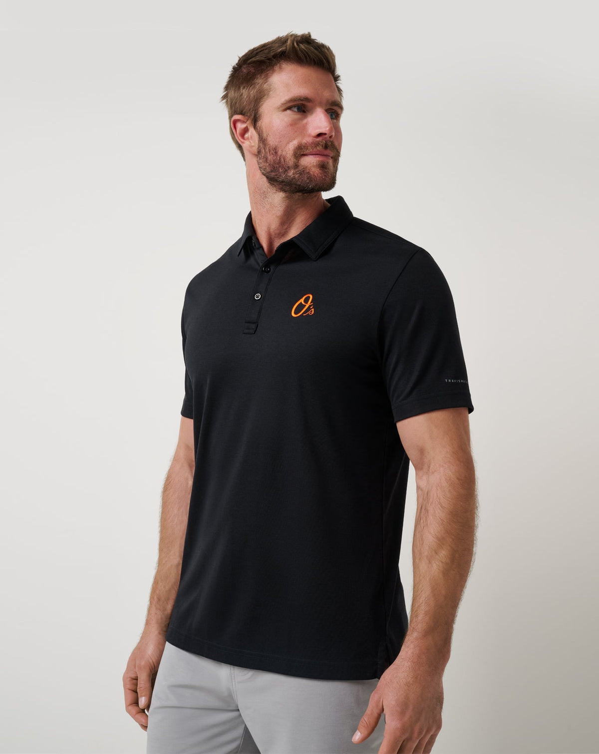 Baltimore Orioles Playoff Pitch Polo Black | Travis Mathew Essential