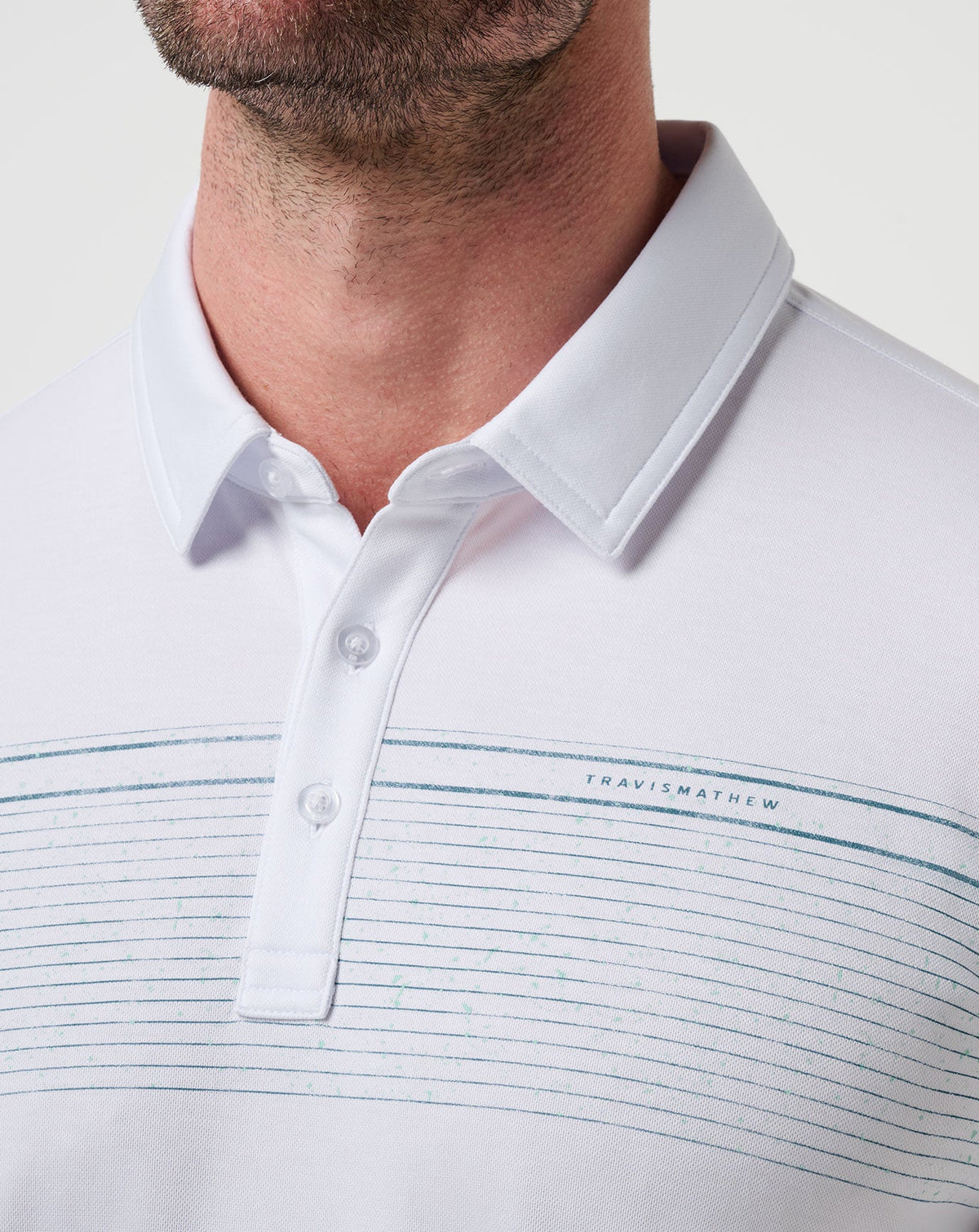 Overstay Polo White | Travis Mathew Signature