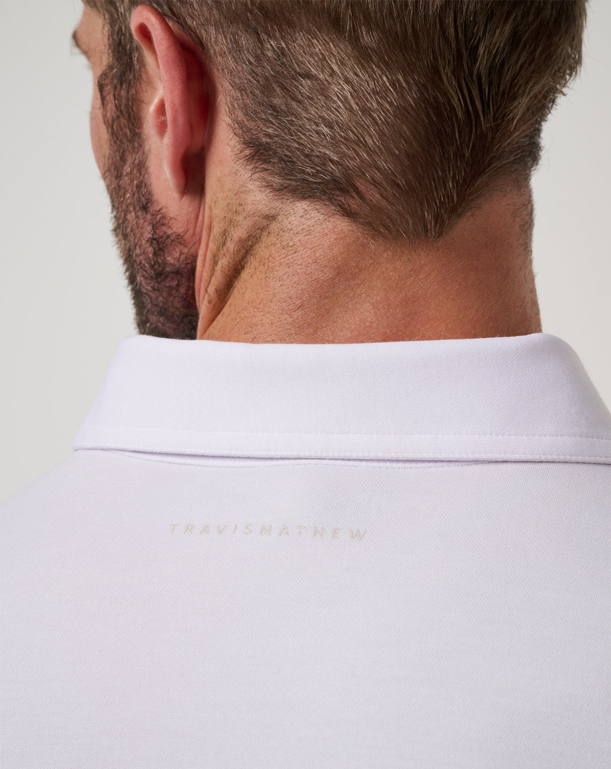 Featherweight On The Grind Polo White | Travis Mathew Essential