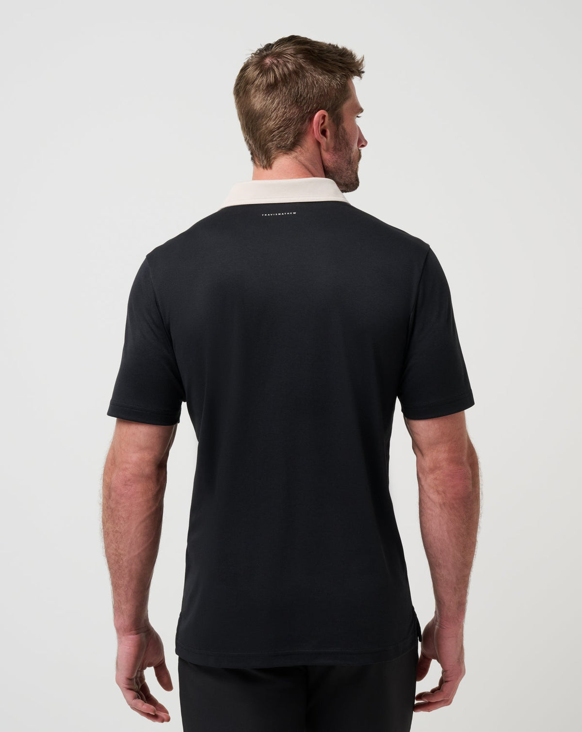 Stick Side Polo Black | Travis Mathew Best Seller