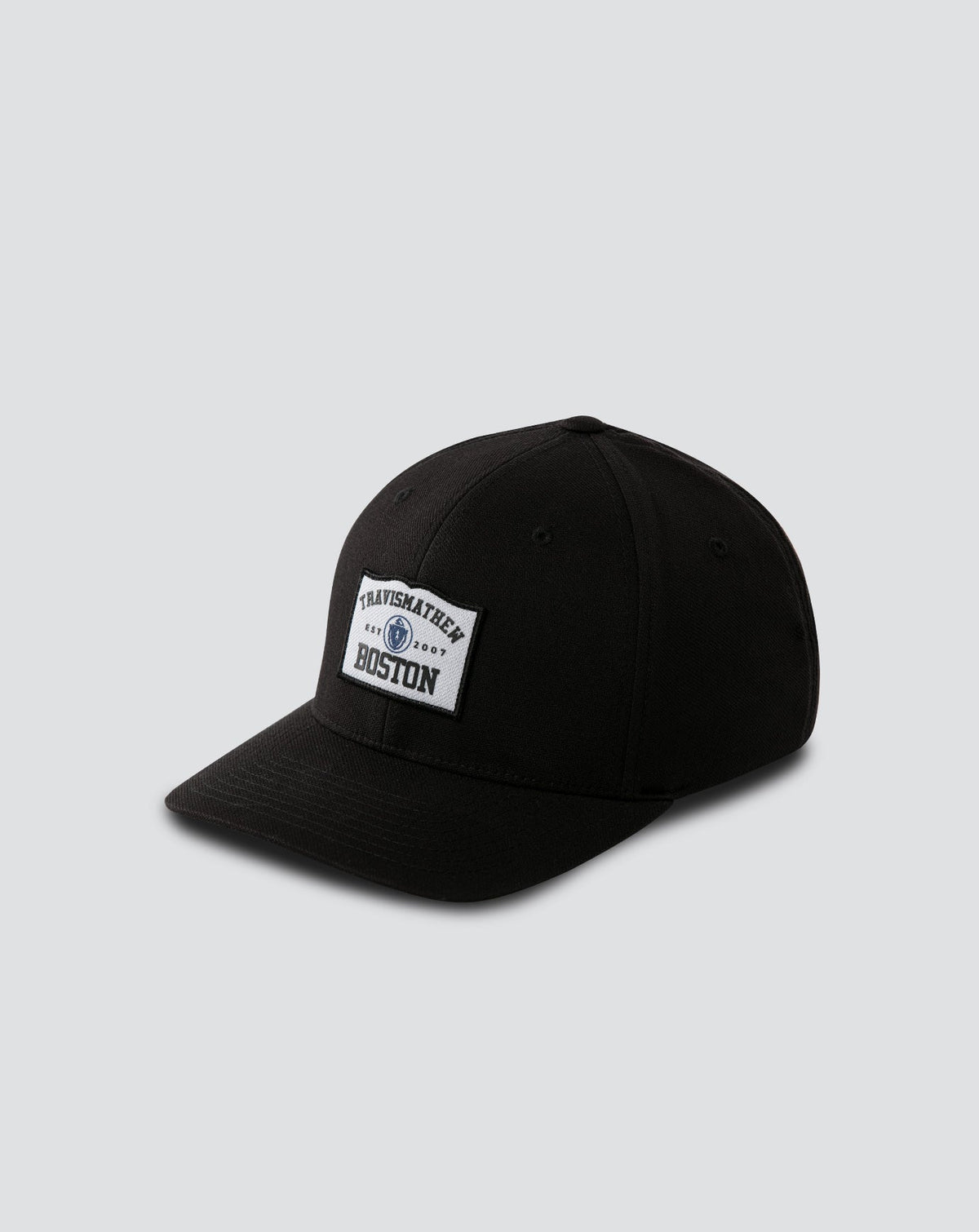 Boylston Fitted Hat Black | Travis Mathew Featured