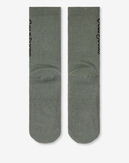 Golf Sucks Crew Sock Dark Olive | Travis Mathew Featured