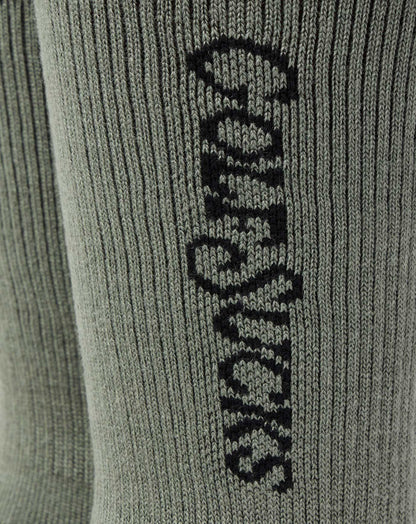 Golf Sucks Crew Sock Dark Olive | Travis Mathew Featured