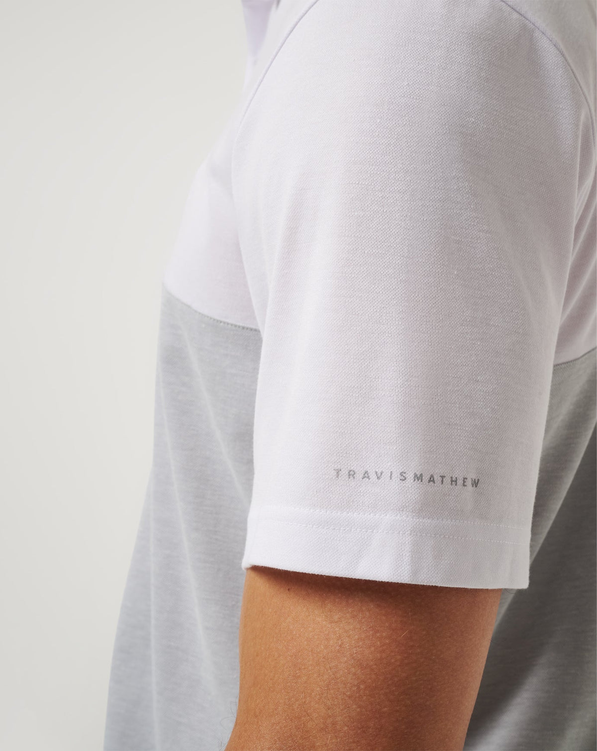 UCLA Drop Back Polo White/Heather Grey | Travis Mathew Everyday