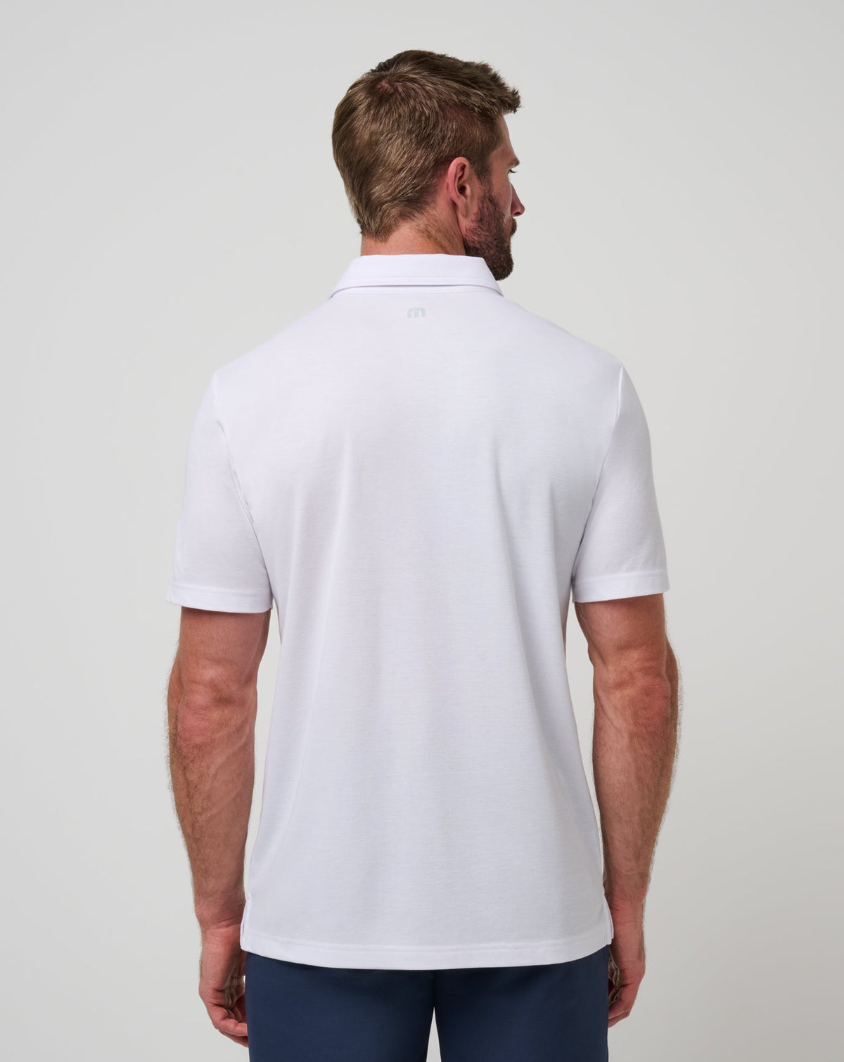 Kansas Top Recruit Polo White/Blue | Travis Mathew Signature