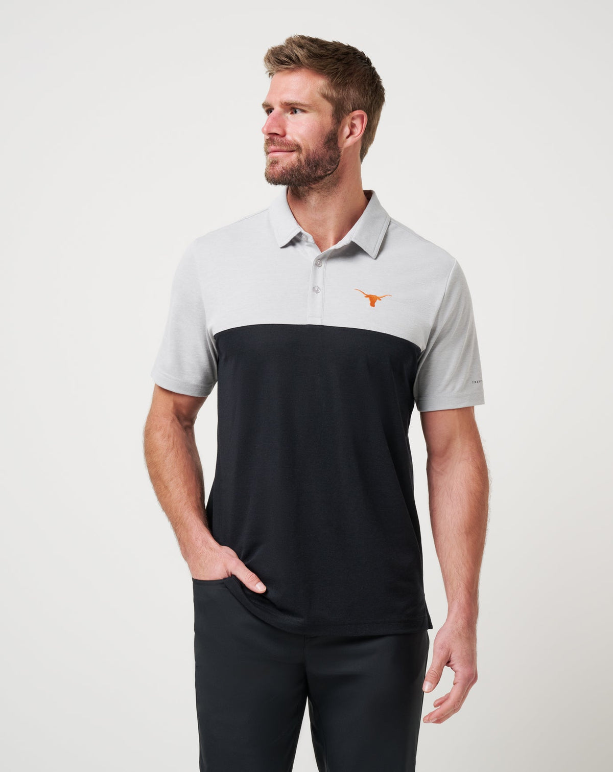 UT Austin Drop Back Polo Heather Grey/Black | Travis Mathew Smart Buy