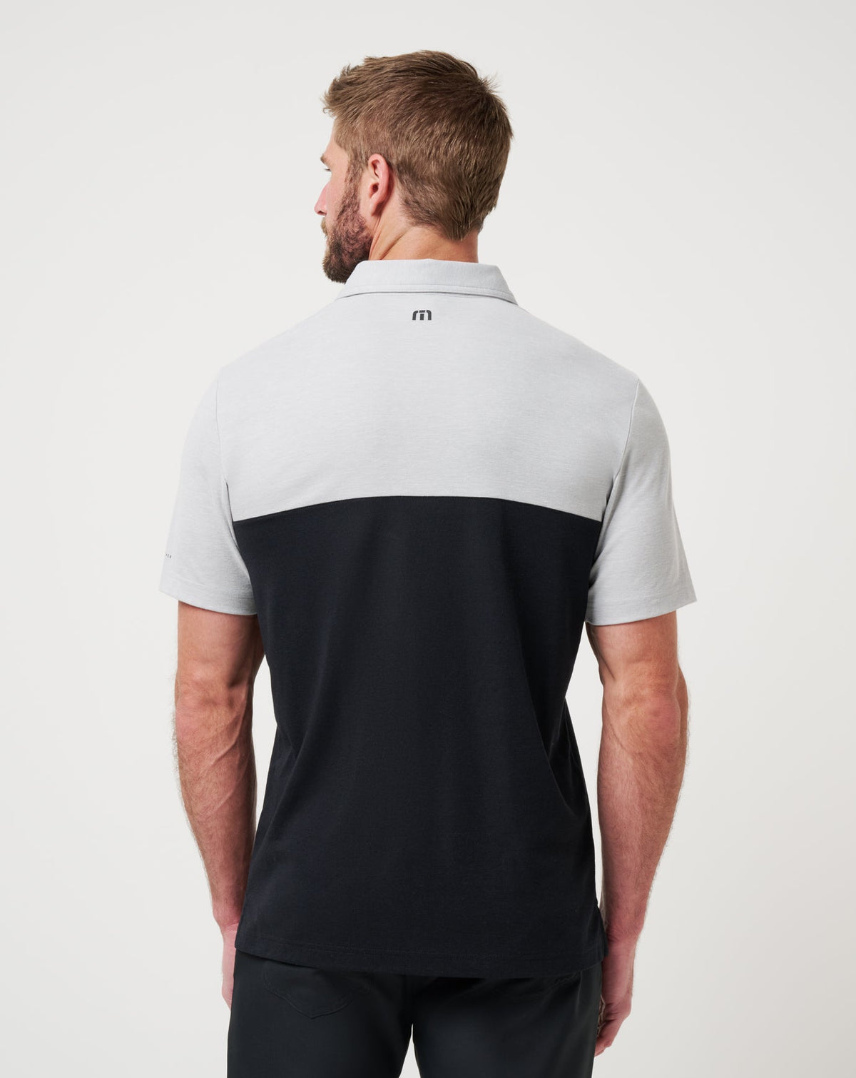 UT Austin Drop Back Polo Heather Grey/Black | Travis Mathew Smart Buy