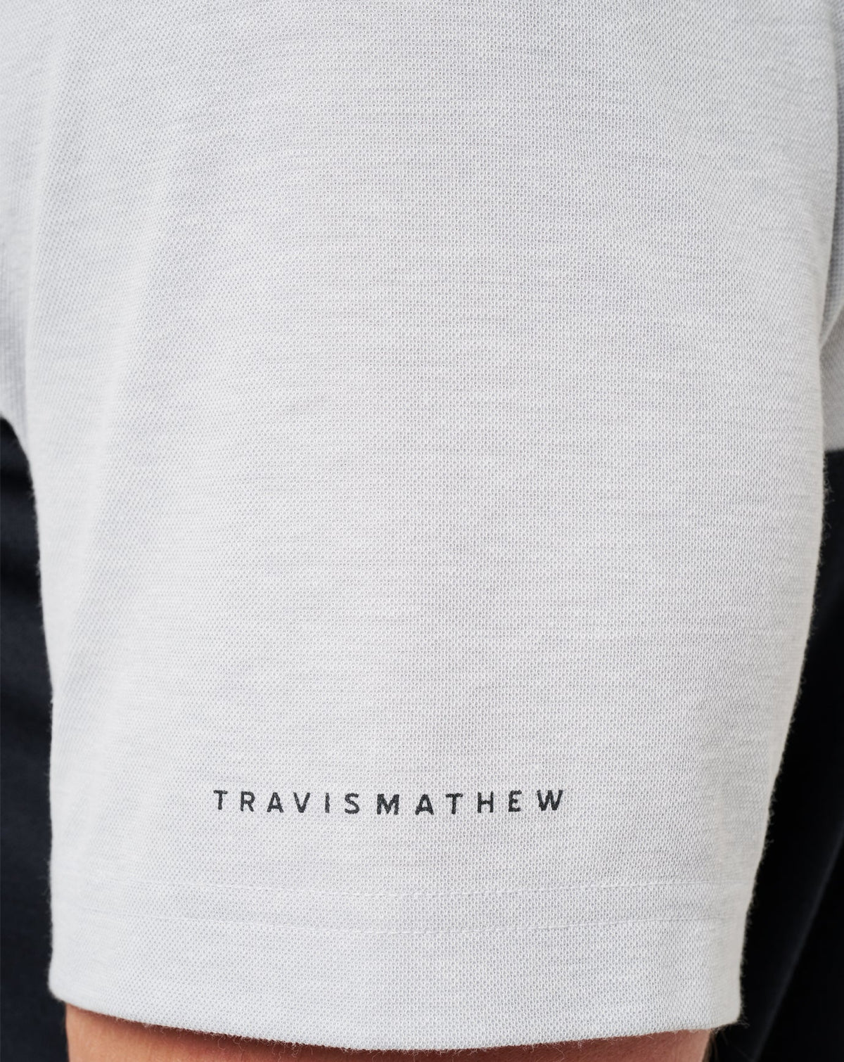 UT Austin Drop Back Polo Heather Grey/Black | Travis Mathew Smart Buy