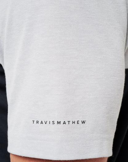 UT Austin Drop Back Polo Heather Grey/Black | Travis Mathew Smart Buy
