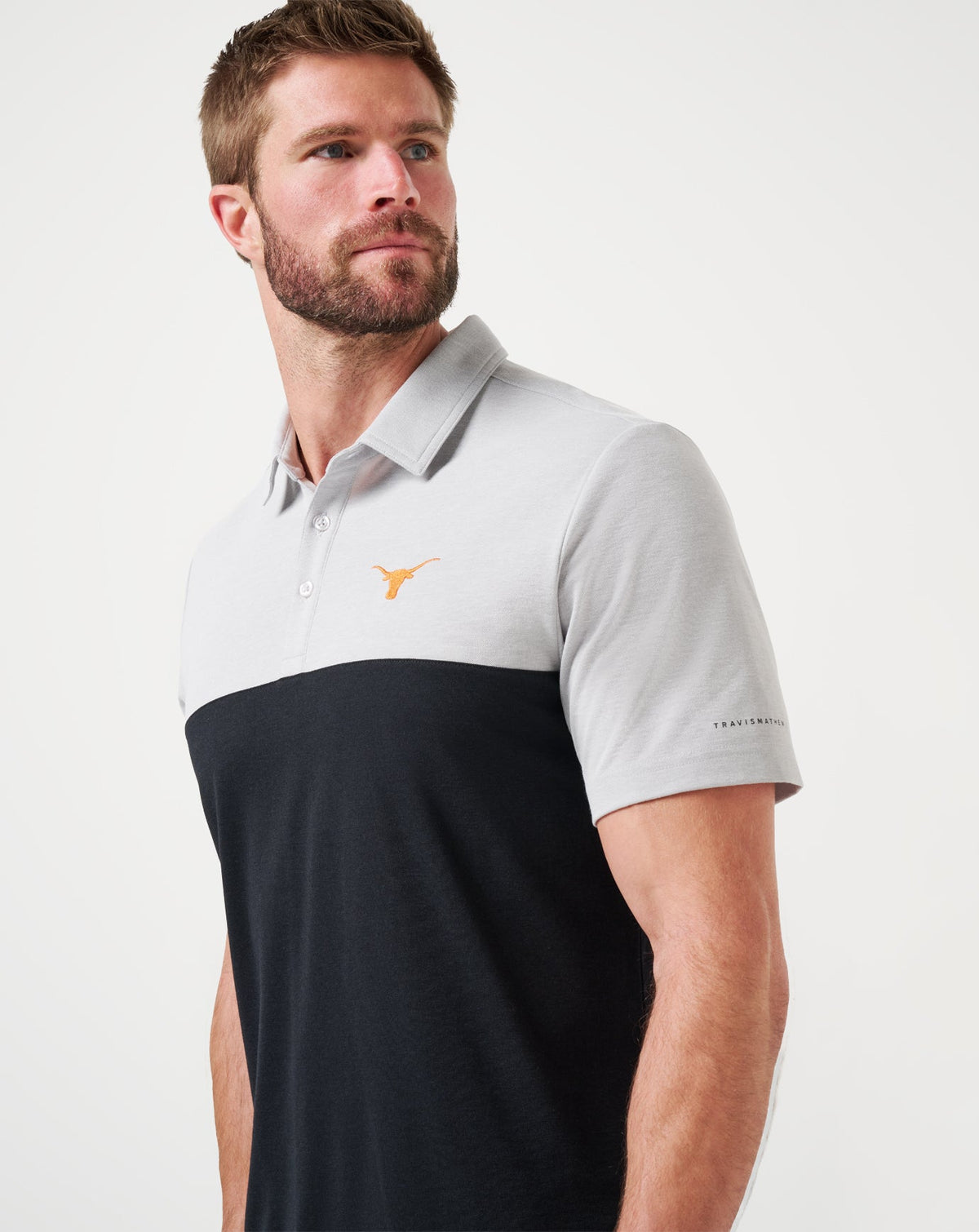UT Austin Drop Back Polo Heather Grey/Black | Travis Mathew Smart Buy
